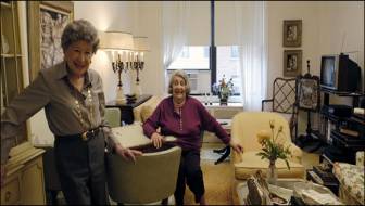 Toussia Pines, left, and June Nelson in Ms. Nelson's living room at the Esplanade, where meals and activities are also provided.