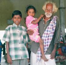 Photo: Older man with orphaned grandchildren John Cobb/Help the Aged