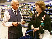 Older employee in a supermarket