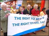 Elderly people marching through Belfast