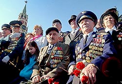 World War II veterans watch a military parade during Victory Day celebrations in Red Square in Moscow, Friday, May 9, 2003. (AP)