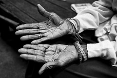 Elderly woman hands up - Issan, Thailand by
                  Sailing "Footprints: Real to Reel" (Ronn
                  ashore)