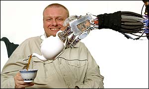 Mark Worsdall, a programmer at Shadow and a spinal muscular atrophy sufferer, being poured a cup of tea by the Shadow Robotic Arm