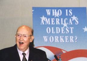 A smile keeps America's Oldest Worker, 100 years old architect Harold H. Fisher young at heart.