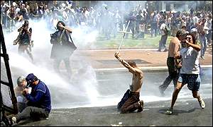 Demonstrators are sprayed with water cannon in Buenos Aries