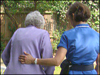 Elderly woman and a nurse