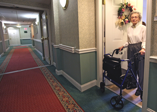 A nursing home resident with a motorized walker.