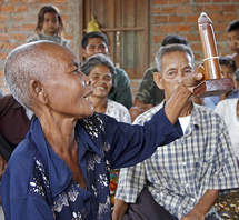 Older people watch a condom demonstration in Cambodia. Photo: HelpAge International/Nile Sprague.
