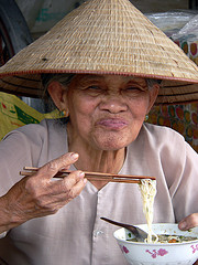 Old Vietnamese Lady Eating by HellonEarth2006