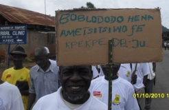 Description: An ADA activist joins a march in Ghana