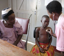 Older woman takes her grandson for a medical check-up. Photo: Kate Holt/HelpAge International.