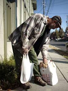 John Treece, 60, leaves the Bread for the City food pantry in the Anacostia section of Washington, D.C., on Nov. 2, 2006.