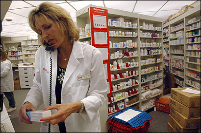 Part-time Rhode Islander Paula San Souci works as a pharmacist at a CVS store in Marco Island, Fla., in winter.