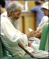 Elderly man waits for treatment