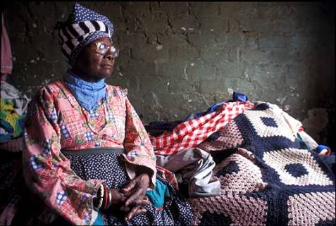 Old woman caring for aids orphans