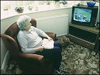 Pensioner watching television