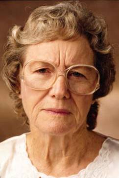 Picture of elderly female frowning slightly.