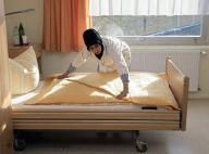 A caregiver prepares a room for its first guest